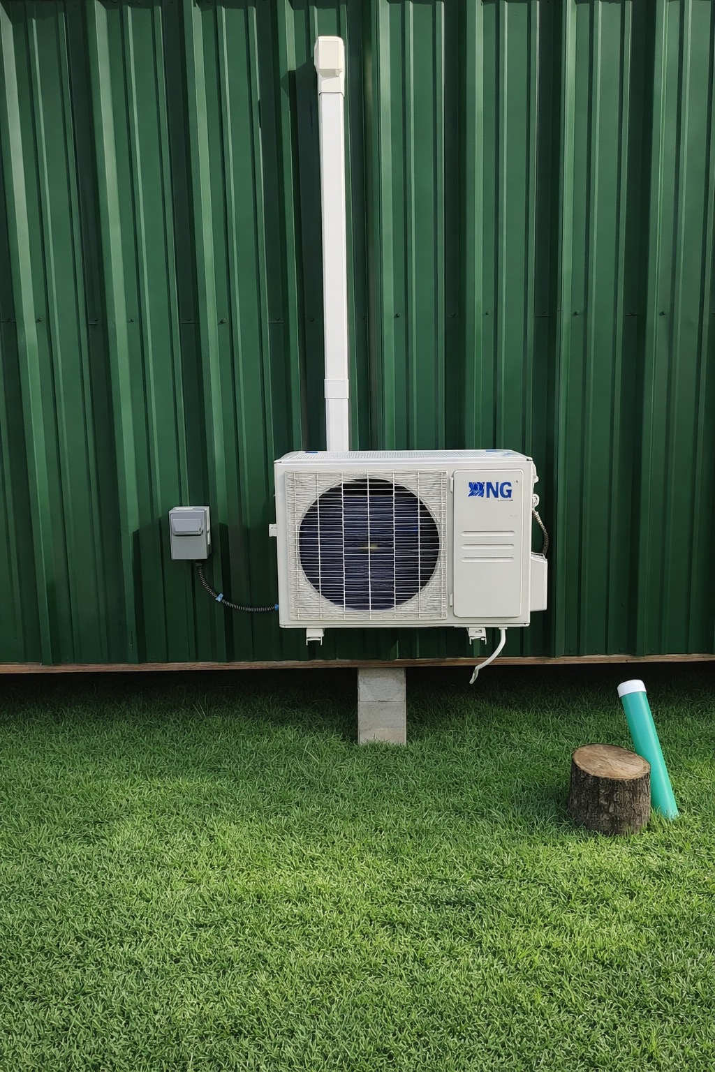 Mini-split outdoor unit installed on a metal building
