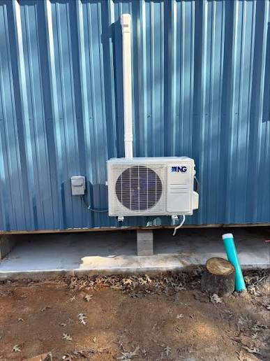 Mini-split outdoor unit installed on a metal building